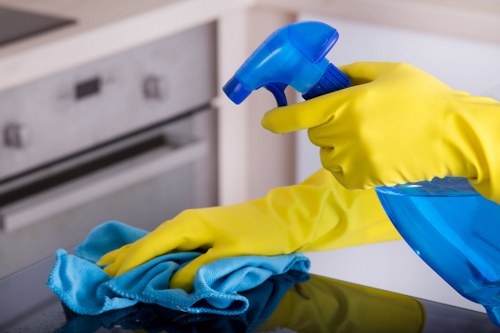 A carpet cleaner treating a stained living room floor