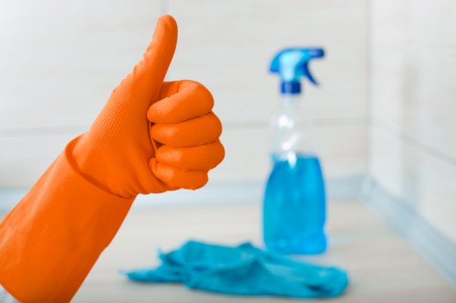 Technician safely moving furniture before cleaning the carpet